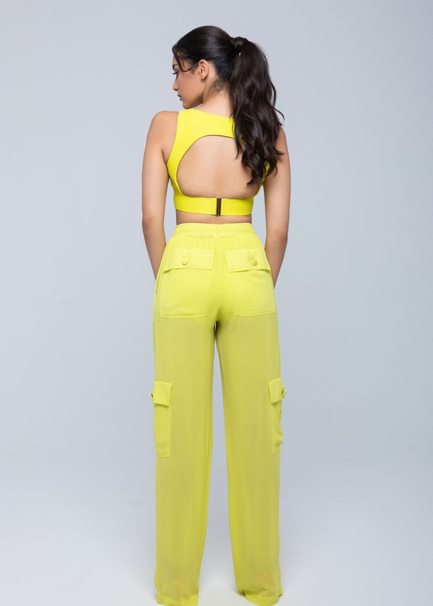 Lightweight sheer pants styled as swimwear cover-up for summer nights
