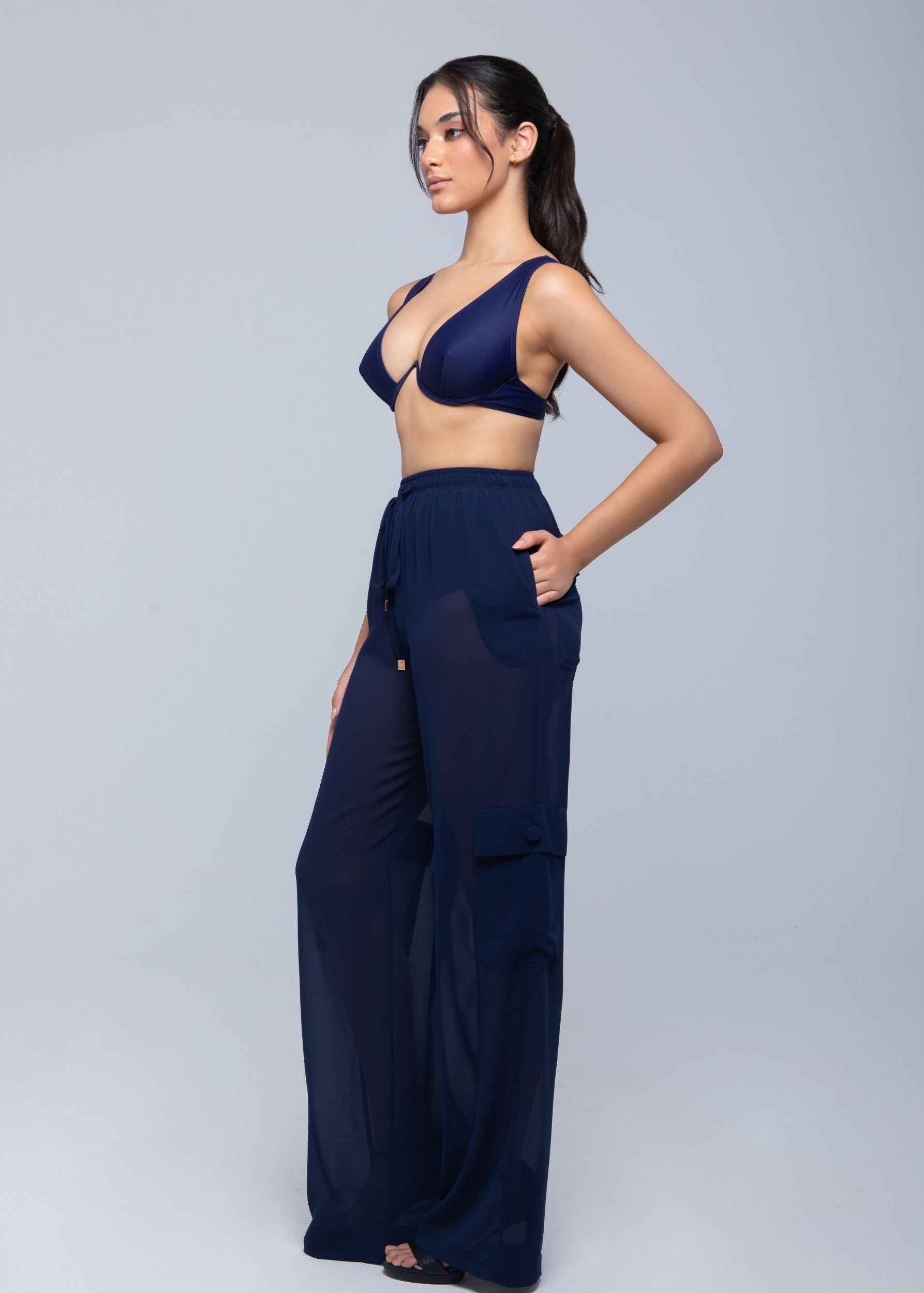 Lightweight sheer pants styled as swimwear cover-up for summer nights