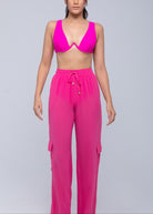 Lightweight sheer pants styled as swimwear cover-up for summer nights