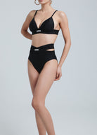 woman wearing Fierce Activewear's black X-Shape high-waisted bikini bottom with side cut-outs, paired with a matching black triangle bikini top
